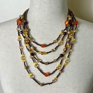 Multi-strand orange, yellow, brown beaded necklace